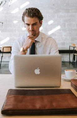 Lucleon Montre Grover Imperial -LuxeMontre Boutique man in shirt with laptop and accessories